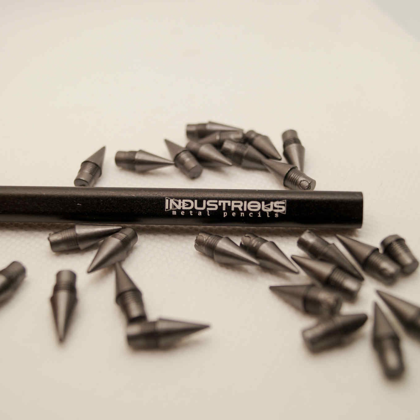 Metal pencil with extra graphite tips