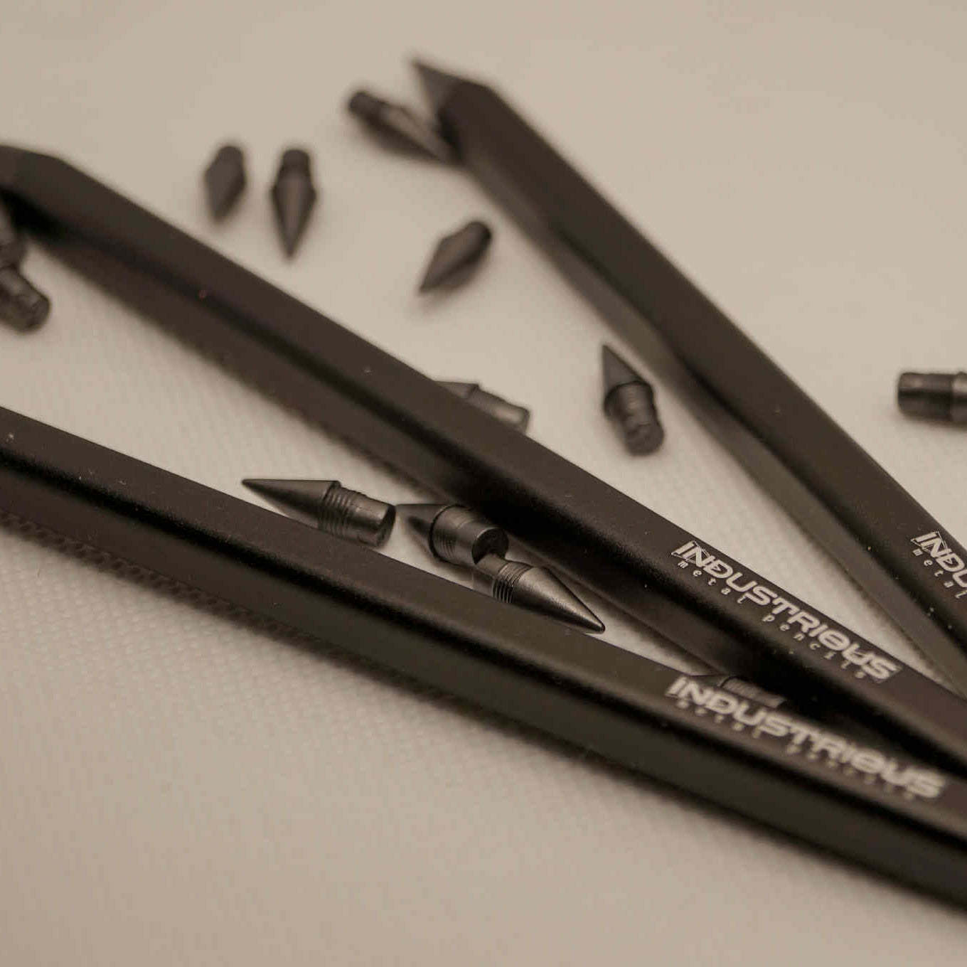 Metal pencil with extra graphite tips
