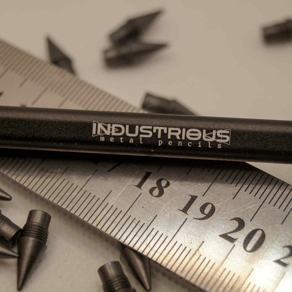 Metal pencil with extra graphite tips